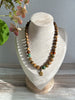 Earthy Necklace Featuring Matte Colourful Druk Beads & a Brass Wheat Grass Charm
