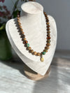 Earthy Necklace Featuring Matte Colourful Druk Beads & a Brass Wheat Grass Charm