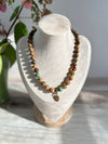 Earthy Necklace Featuring Matte Colourful Druk Beads & a Brass Wheat Grass Charm