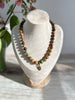 Earthy Necklace Featuring Matte Colourful Druk Beads & a Brass Wheat Grass Charm