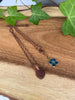 Rich Brown Sea Glass Pendant Necklace With a Beautiful Flower Charm